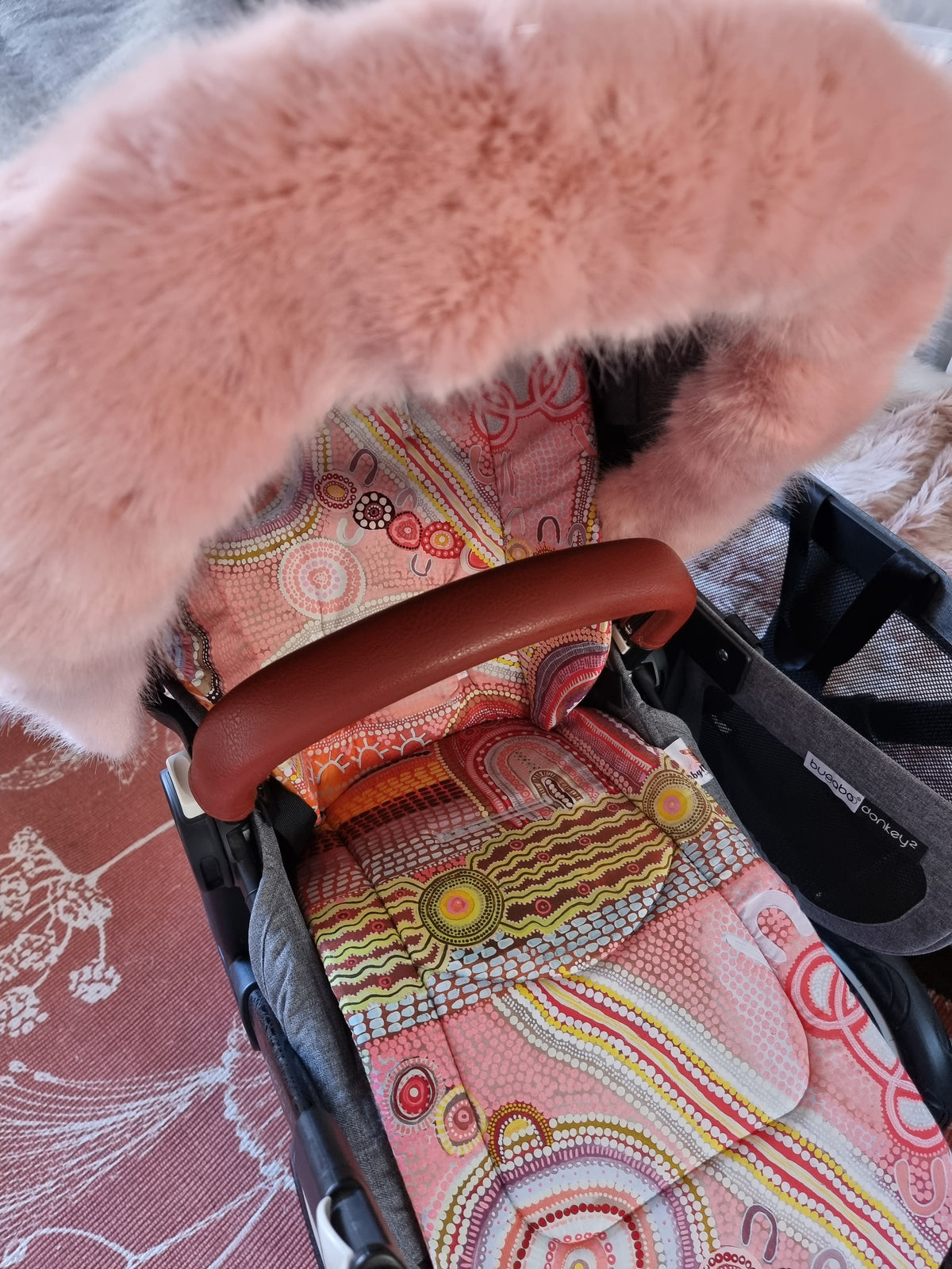 Pink pram 2024 with fur hood